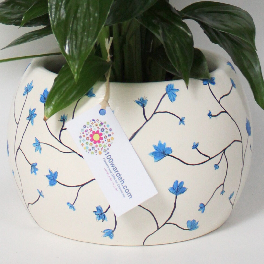 White Pot with Pink and Purple Flowers